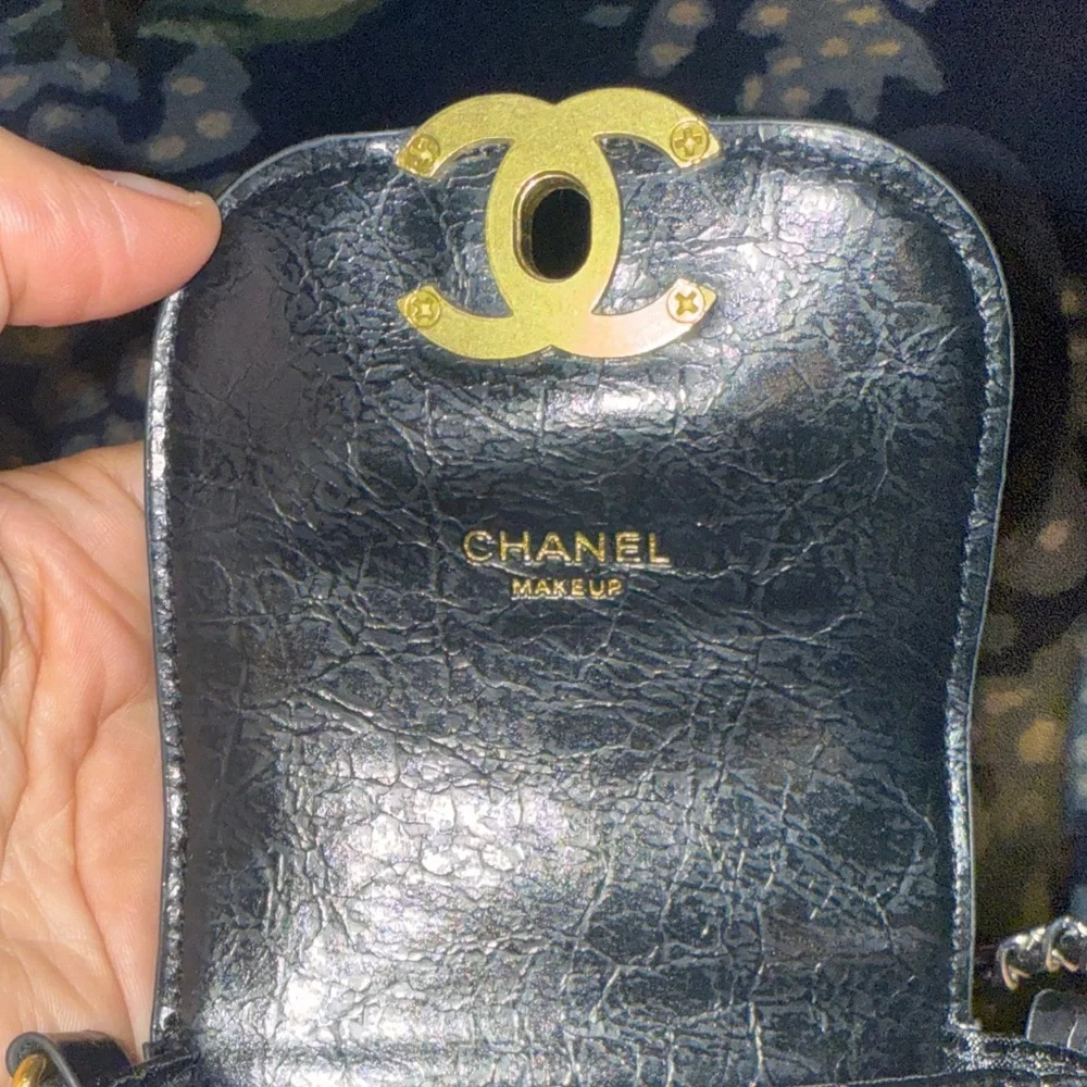 CHANEL Black Quilted Mini Bag with Gold Accents